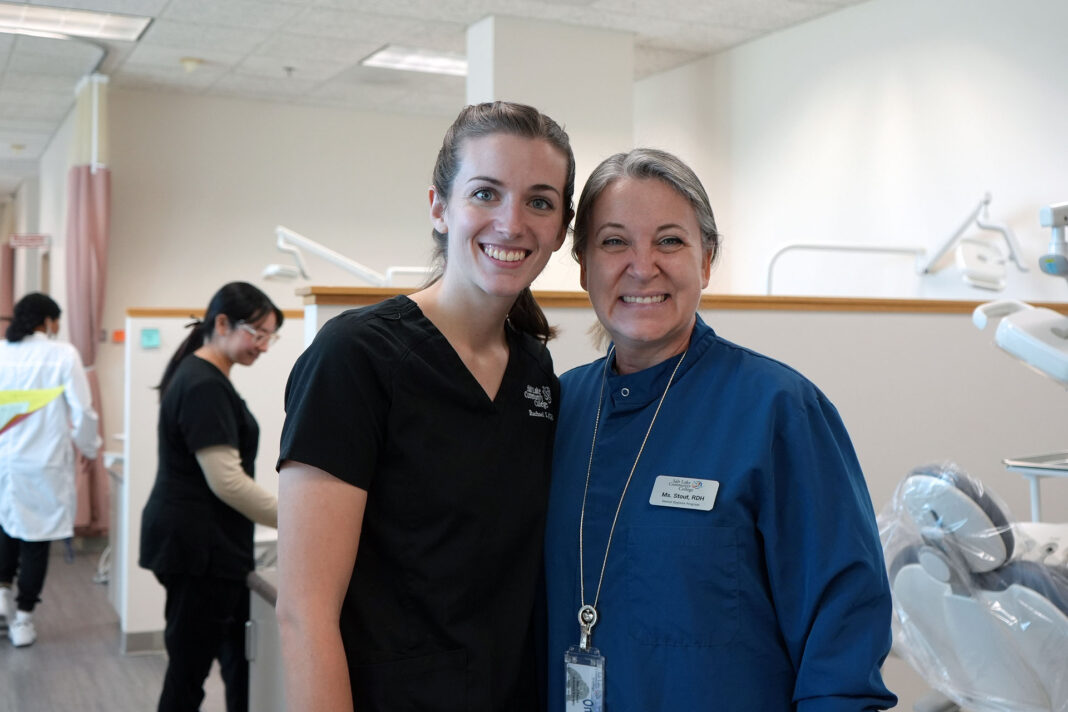 Dental hygiene student posing for a picture with their instructor