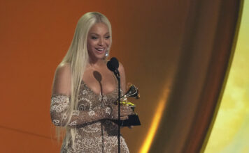 Students review the 67th Grammy Awards Beyonce accepting Grammy award for best country album