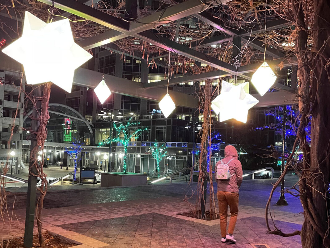 Illuminated stars hanging from rafters