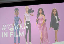 SLCC club fundraiser spotlights women in film Projection screen displaying "Women in Film" juxtaposed with Barbie dolls