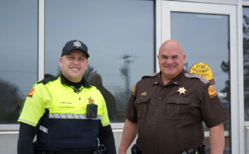 How students can utilize campus safety services UHP Trooper Williams and Lt. Winward standing outside the Gunderson Building