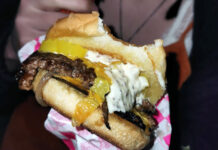 Girls Who Smash: A smashburger worth fighting for Close up of a smashburger with one bite