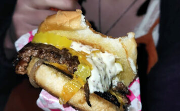 Girls Who Smash: A smashburger worth fighting for Close up of a smashburger with one bite