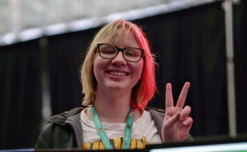 ‘Ignore it’: Despite industry growth, some women in gaming say skepticism and online aggression persists Jeniel giving a V sign hand gesture