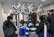 Following rebrand, SLCC’s student engagement office continues its mission Silver "SEEA" balloons floating above meet-and-greet welcome table