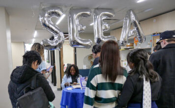 Following rebrand, SLCC’s student engagement office continues its mission Silver "SEEA" balloons floating above meet-and-greet welcome table