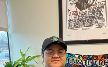 SLCC students comment on finding balance between work and college Tricio Salgado standing in an office