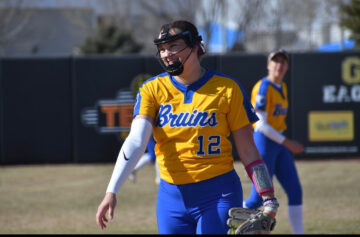 From the mound to mentorship: Taylor Hagen’s softball journey Taylor Hagen wearing a face guard while pitching