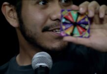 What’s Bruin’ – Charades and BeanBoozled Challenge Contestant holding a game wheel to the camera