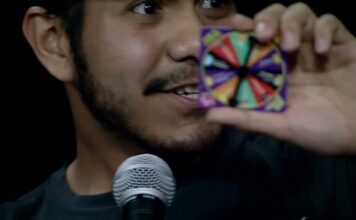 What’s Bruin’ – Charades and BeanBoozled Challenge Contestant holding a game wheel to the camera