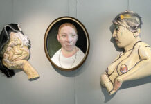 Powerful paintings and sculptures grace South City Campus Three art pieces being displayed in a gallery