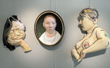 Powerful paintings and sculptures grace South City Campus Three art pieces being displayed in a gallery