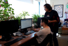 Students and e-portfolio: squeaky wheels and kaleidoscopes Two students working on a computer in a lab