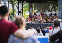 Living Traditions: Celebrate spring, celebrate Salt Lake Crowd in foreground watching traditional dance on a stage