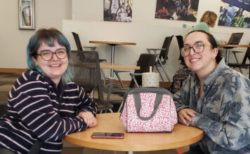 Federal cuts to PBS, NPR cause concern in the SLCC community Hannah and Janaye seated at a table in the forum