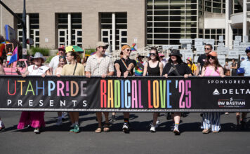 35th Utah Pride Parade defies obstacles to entertain thousands Parade participants hold “Radical Love '25” event banner to start parade