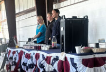 A traditional Memorial Day breakfast Three volunteers preparing to serve attendees