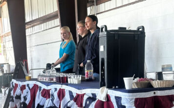A traditional Memorial Day breakfast Three volunteers preparing to serve attendees
