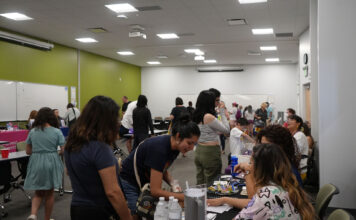 SLCC’s ‘Together We Thrive’ event uplifts community Guests interacting with organizations at a resource fair