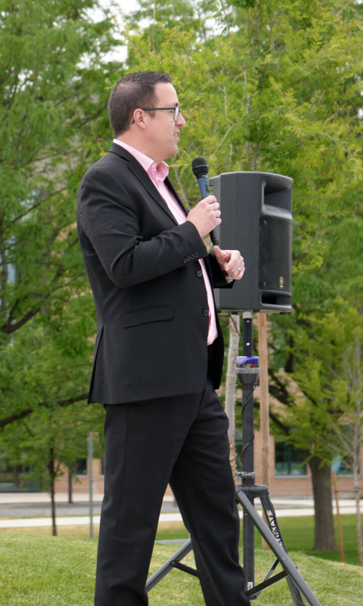 Gary speaking into a microphone