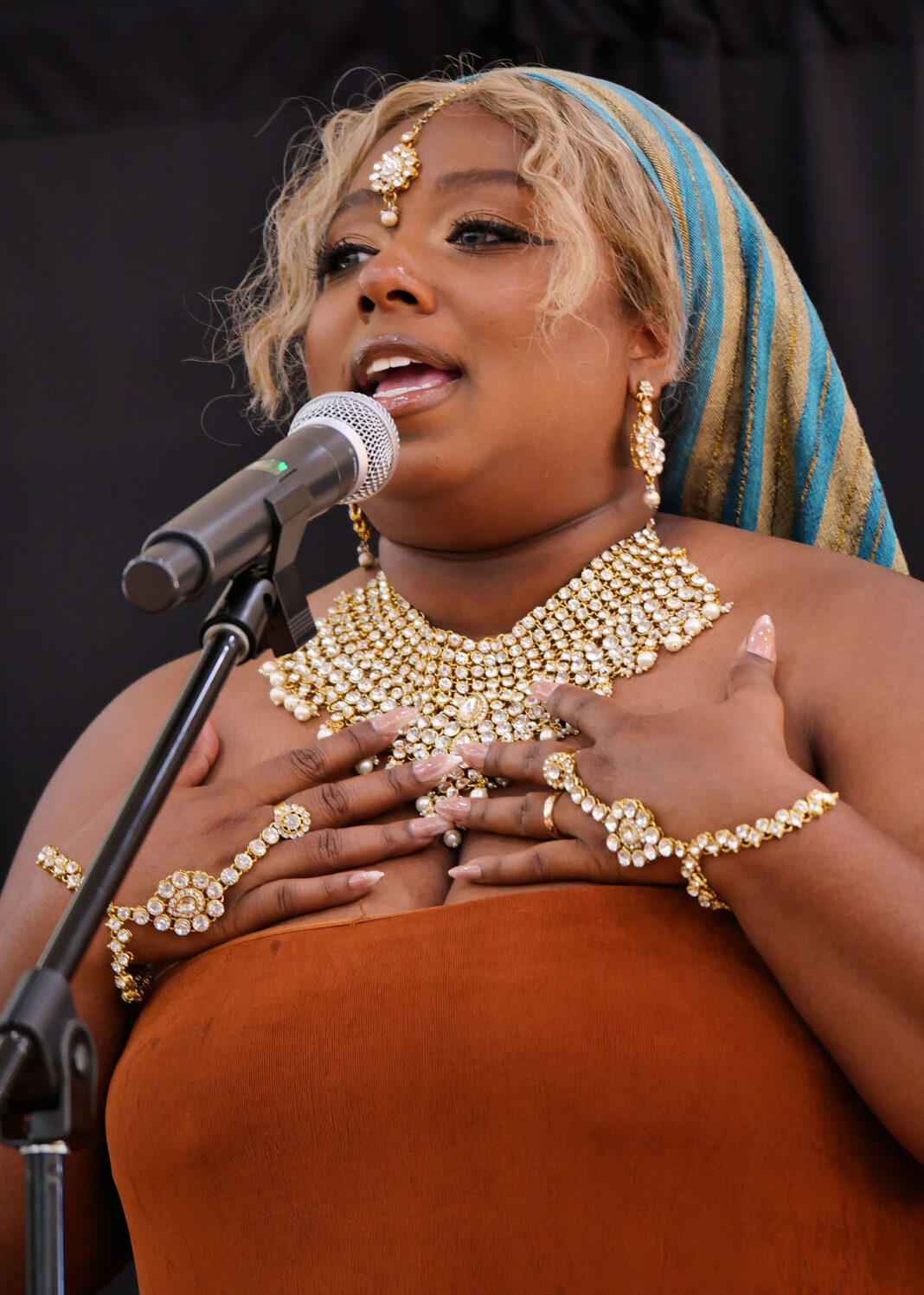 Destinae Faye speaking into a microphone