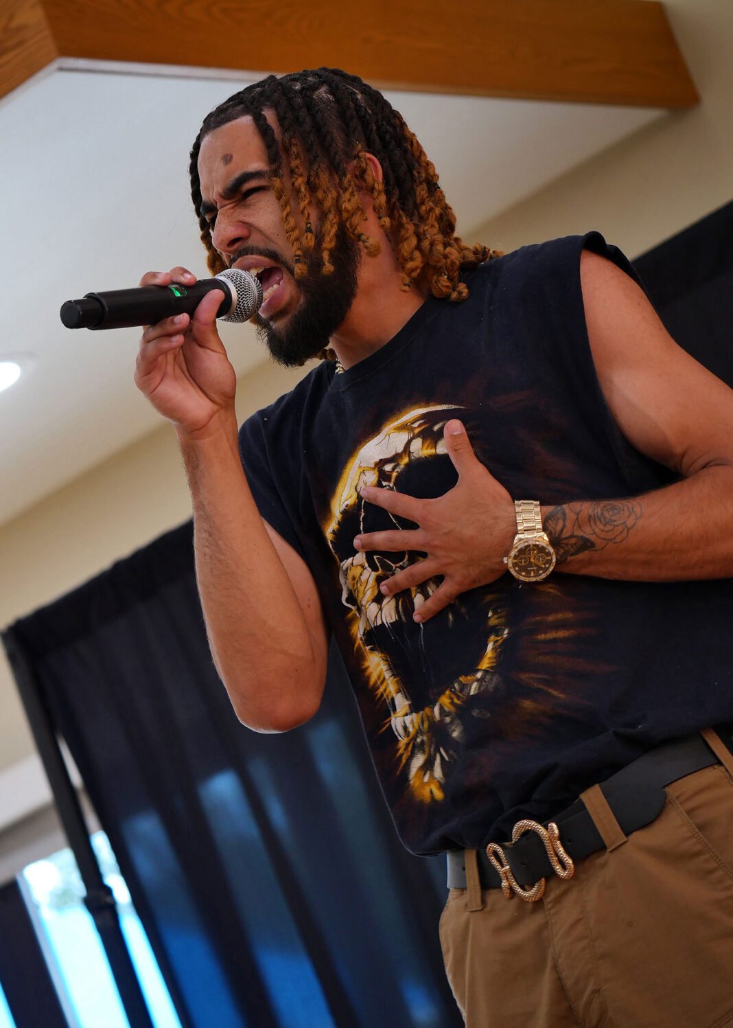 Alexander Galore singing into a microphone