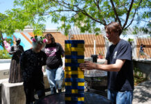 SLCC Pride Picnic brings community together Keegan deciding what Jenga piece to move