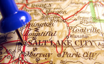 Time for Utah’s holiday to be about – Utah Blue pushpin pointing to Salt Lake City on a map
