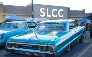 Photos: Lowriders, community members ‘Hop into College’ at SLCC West Valley Center Lowriders parked in front of campus building lit up by large SLCC letter sign