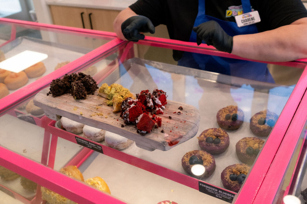 Donut samples being displayed on top of glass case