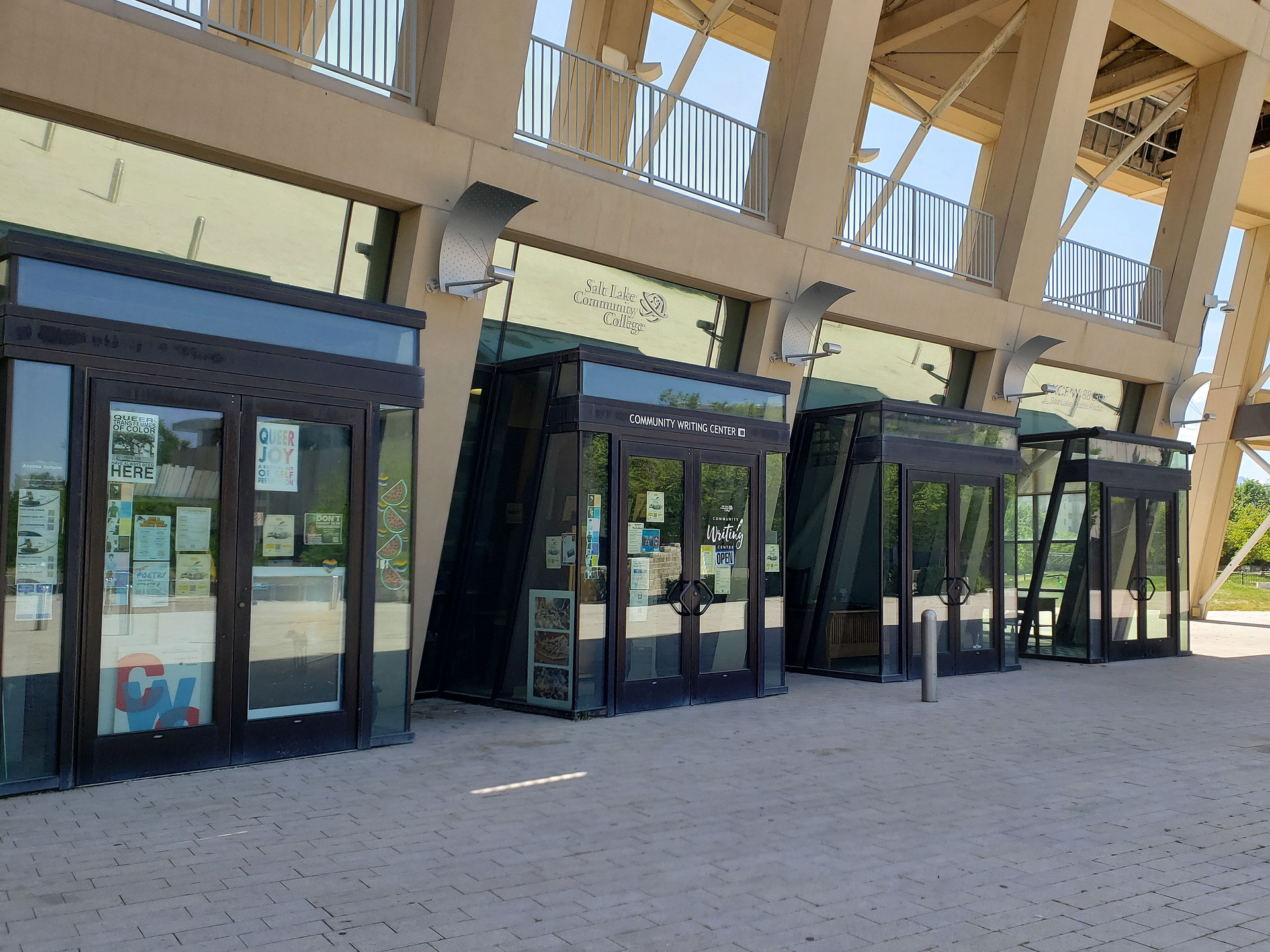 Suites with glass doors and windows facing a walkway