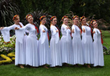 Photos: Folk Festival at International Peace Gardens Dancers wearing white dresses and red floral headbands