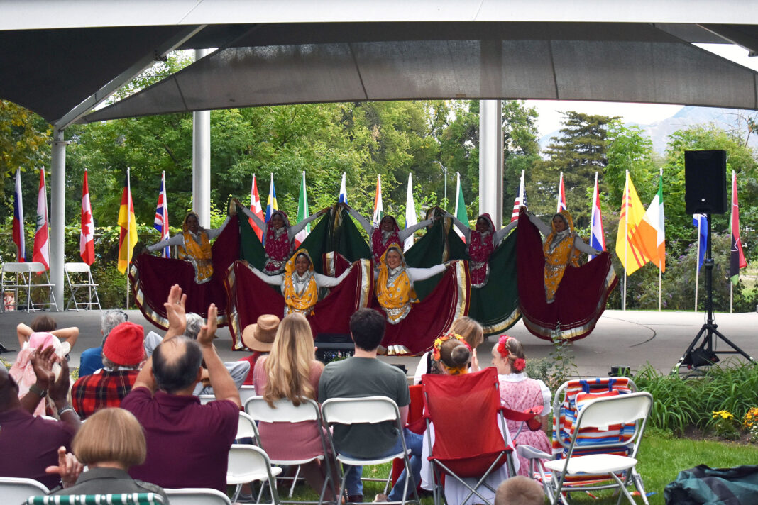 Crowd cheering a group of dancers at the end of their performance