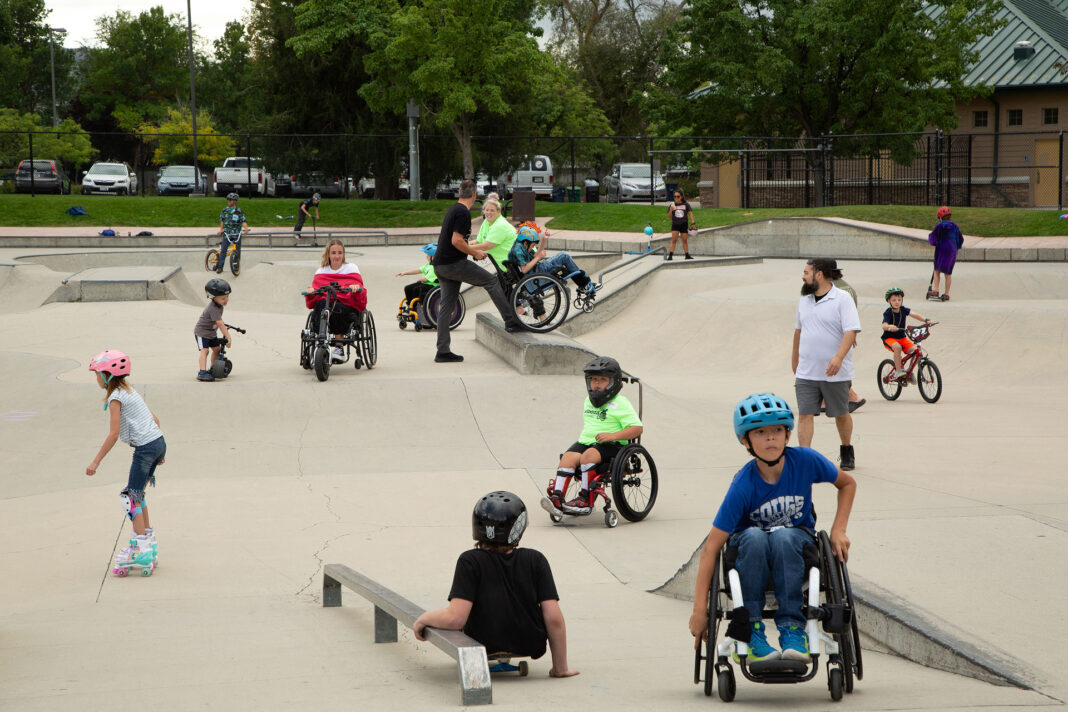 People of all ages and abilities enjoying a skate park