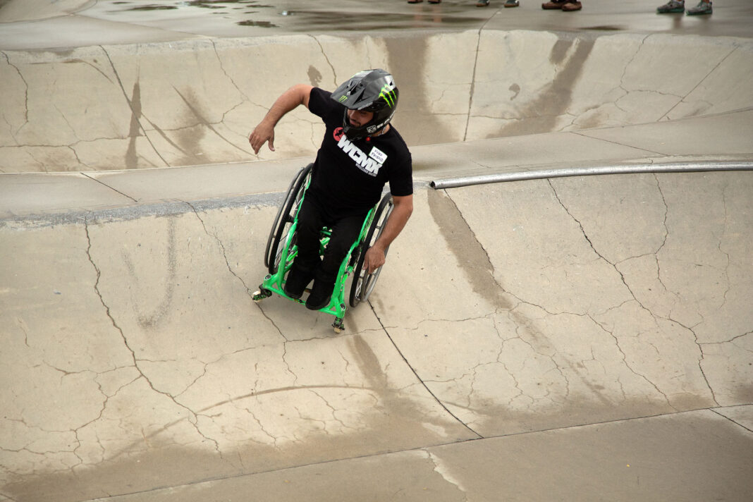 Aaron Fotheringham wheeling on a skate ramp