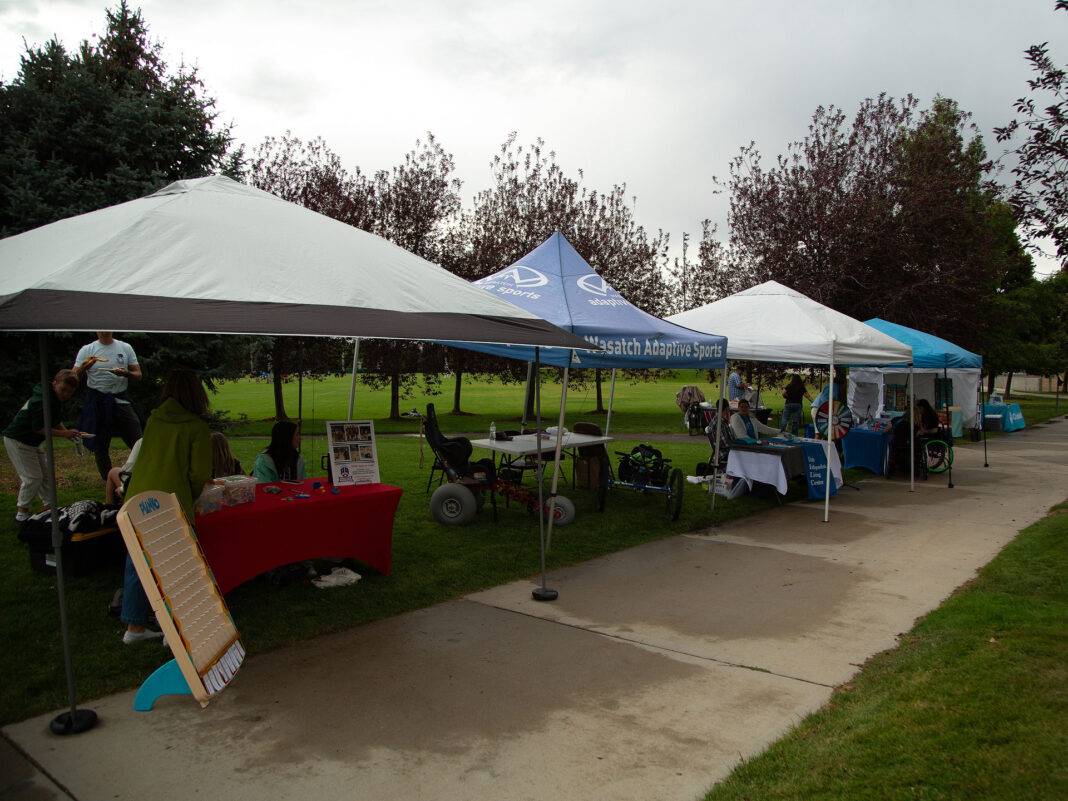 Canopies lining a sidewalk in a park