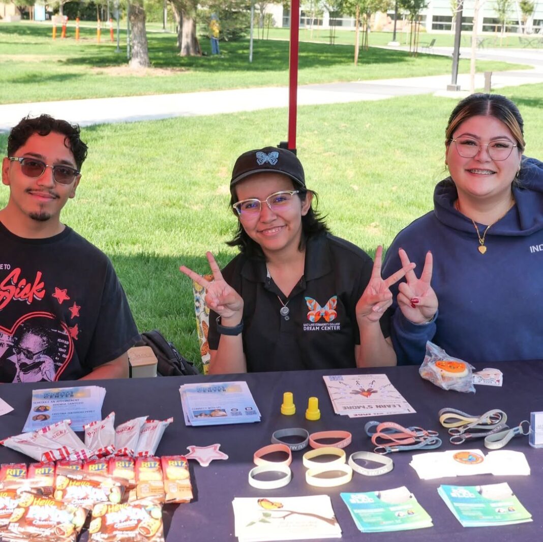 Noah, Amina and Eli greeting event attendees