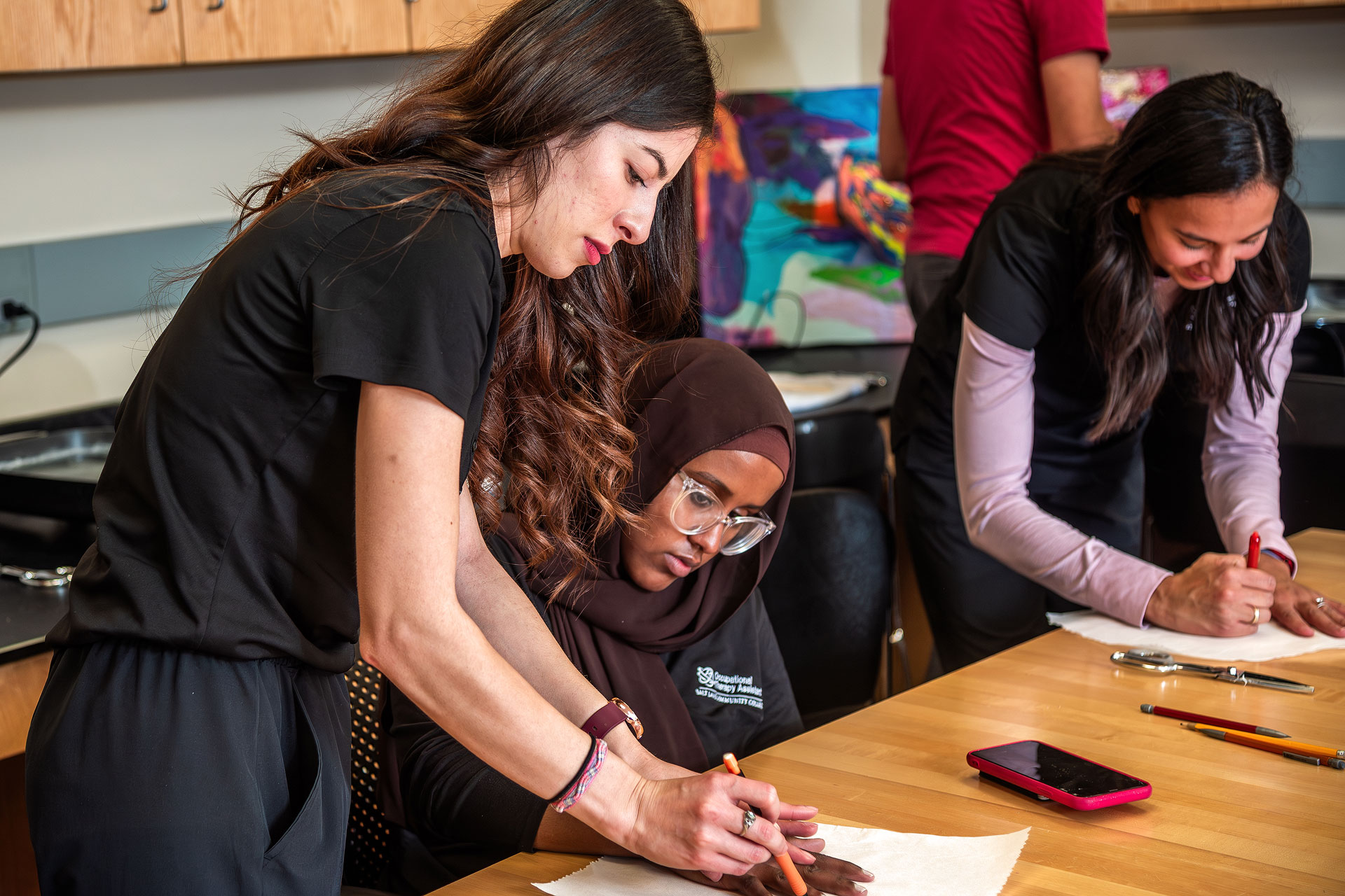 Therapist helping a patient with a crafting activity