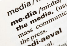 SLCC media professors speak on how AI has changed the field Closeup of a definition of media printed in black text