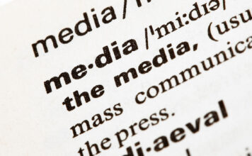SLCC media professors speak on how AI has changed the field Closeup of a definition of media printed in black text