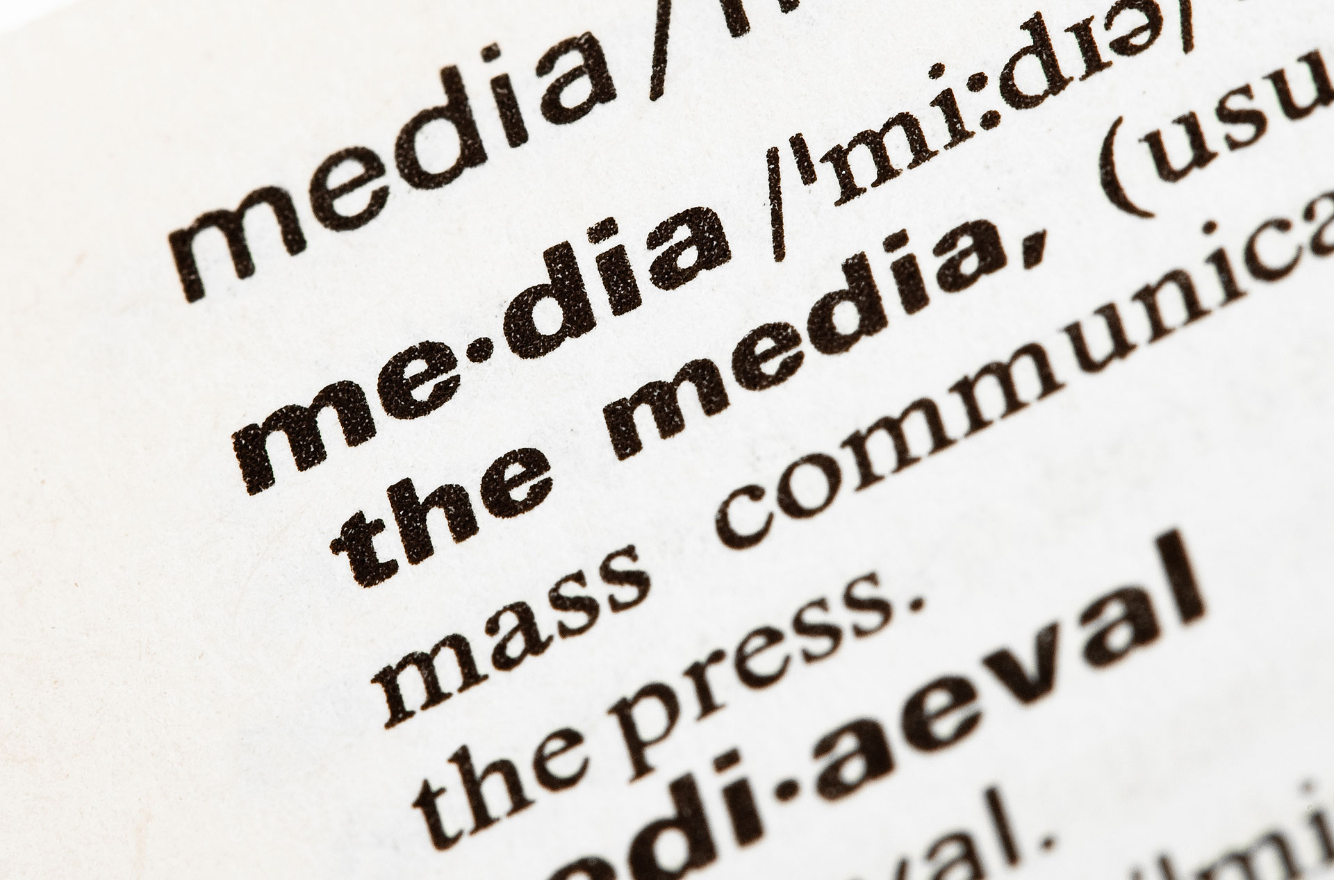 Closeup of a definition of media printed in black text