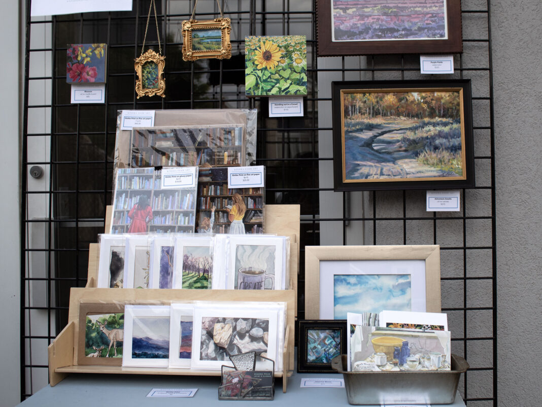 Miscellaneous paintings and prints being displayed