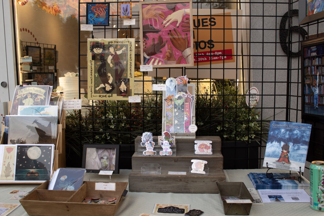 Various art pieces being displayed on shelves and racks