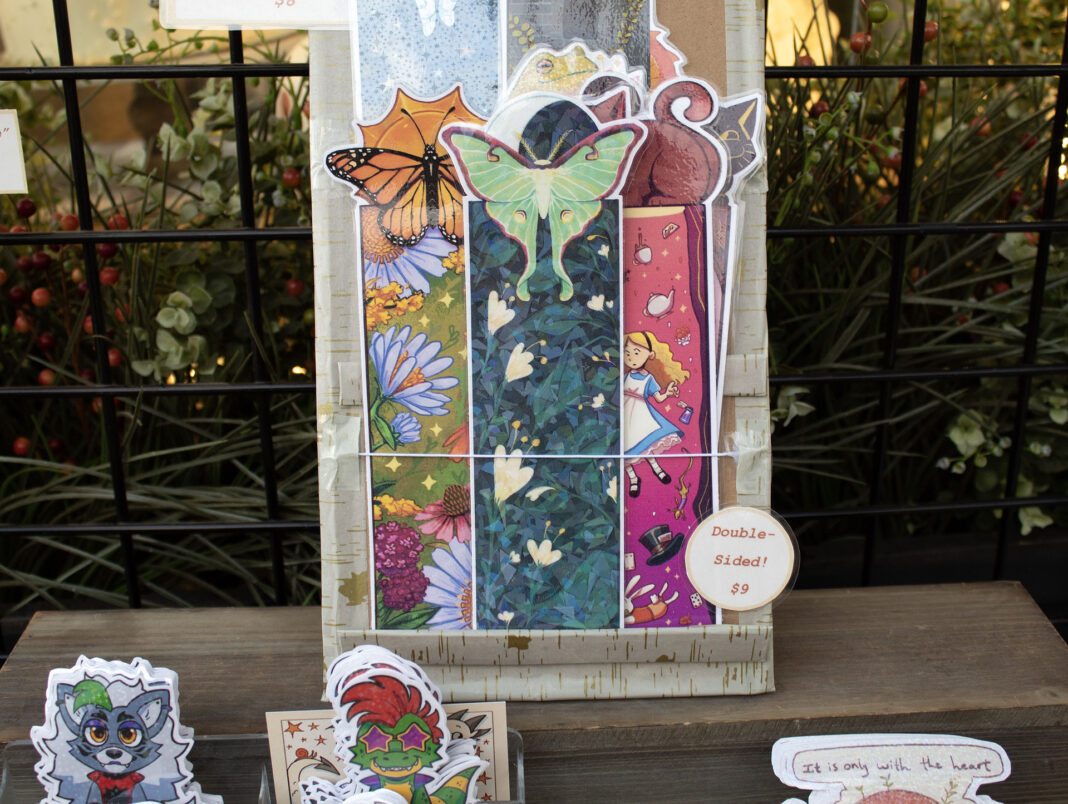 Bookmarks and stickers being displayed for sale