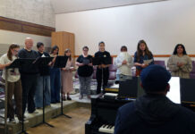 SLCC Choir tunes up for a busy season Juan playing piano as choir students sing a song