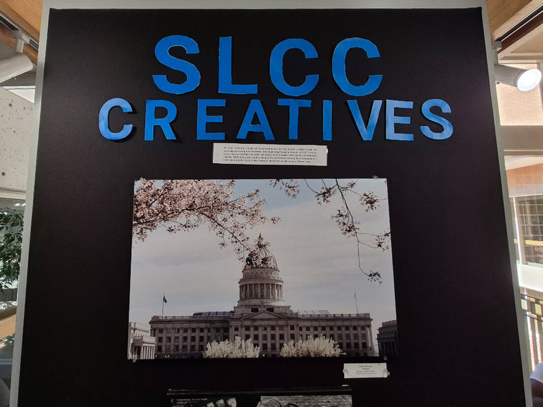 "SLCC Creatives" wall board with print hanging on it