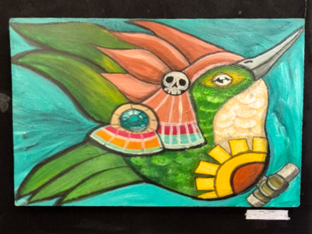 Painting of a hummingbird hanging on display