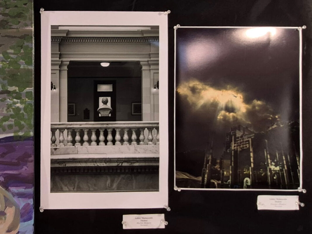 Photographs being displayed on a wall board