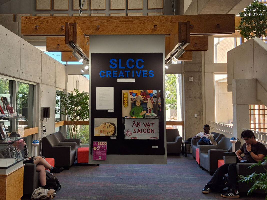 Wall board of art being displayed in center of alcove