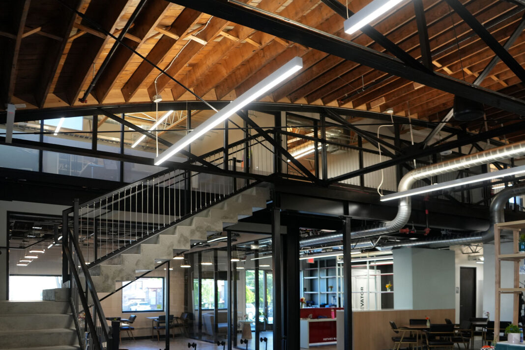 Upward view of stairwell leading to second floor, above office suites